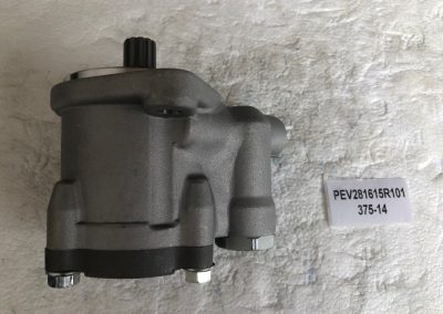 A gray motor on the wall with a sign