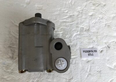 A gray motor sitting on top of a wall.